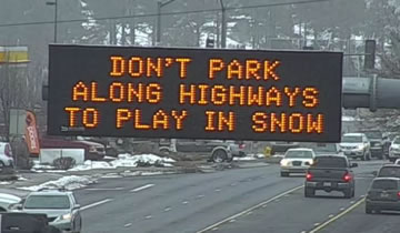 Don't park along highways to play in snow.